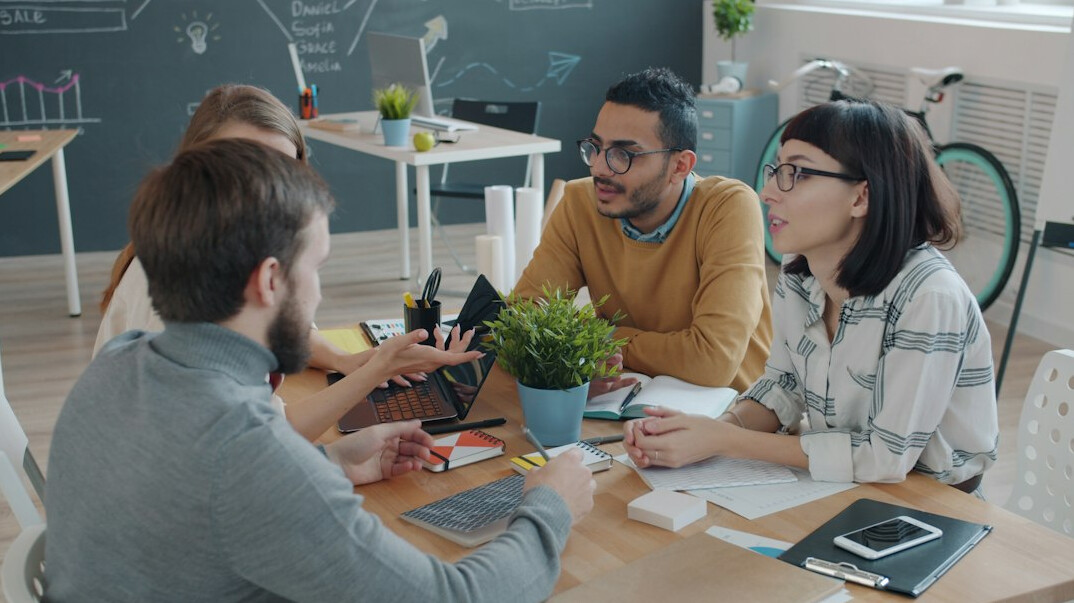 diverse group discussing plans